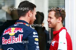 (L to R): Christian Horner (GBR) Red Bull Racing Team Principal with Sebastian Vettel (GER) Ferrari. 04.09.2015. Formula 1 World Championship, Rd 12, Italian Grand Prix, Monza, Italy, Practice Day.
