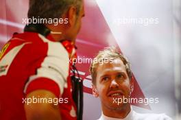 Sebastian Vettel (GER) Ferrari with Maurizio Arrivabene (ITA) Ferrari Team Principal. 04.09.2015. Formula 1 World Championship, Rd 12, Italian Grand Prix, Monza, Italy, Practice Day.