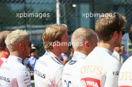 (L to R): Lewis Hamilton (GBR) Mercedes AMG F1 and Nico Rosberg (GER) Mercedes AMG F1 as the grid observes the national anthem. 06.09.2015. Formula 1 World Championship, Rd 12, Italian Grand Prix, Monza, Italy, Race Day.