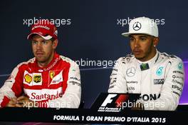 (L to R): Sebastian Vettel (GER) Ferrari with race winner Lewis Hamilton (GBR) Mercedes AMG F1 in the FIA Press Conference. 06.09.2015. Formula 1 World Championship, Rd 12, Italian Grand Prix, Monza, Italy, Race Day.