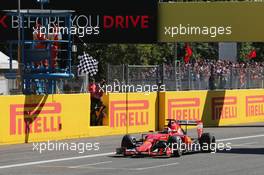 Second placed Sebastian Vettel (GER) Ferrari SF15-T celebrates as he takes the chequered flag at the end of the race. 06.09.2015. Formula 1 World Championship, Rd 12, Italian Grand Prix, Monza, Italy, Race Day.