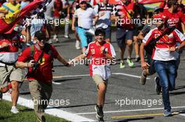 Fans invade the circuit and run to the podium. 06.09.2015. Formula 1 World Championship, Rd 12, Italian Grand Prix, Monza, Italy, Race Day.