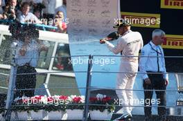 Race winner Lewis Hamilton (GBR) Mercedes AMG F1 celebrates on the podium. 06.09.2015. Formula 1 World Championship, Rd 12, Italian Grand Prix, Monza, Italy, Race Day.