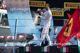 Race winner Lewis Hamilton (GBR) Mercedes AMG F1 celebrates on the podium. 06.09.2015. Formula 1 World Championship, Rd 12, Italian Grand Prix, Monza, Italy, Race Day.