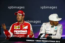 (L to R): Sebastian Vettel (GER) Ferrari and Lewis Hamilton (GBR) Mercedes AMG F1 in the FIA Press Conference. 06.09.2015. Formula 1 World Championship, Rd 12, Italian Grand Prix, Monza, Italy, Race Day.