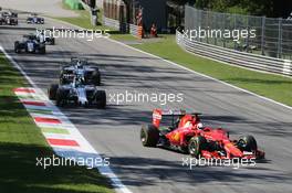 Sebastian Vettel (GER) Ferrari SF15-T at the start of the race. 06.09.2015. Formula 1 World Championship, Rd 12, Italian Grand Prix, Monza, Italy, Race Day.