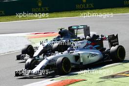 Valtteri Bottas (FIN) Williams FW37 and Nico Rosberg (GER) Mercedes AMG F1 W06 battle for position. 06.09.2015. Formula 1 World Championship, Rd 12, Italian Grand Prix, Monza, Italy, Race Day.