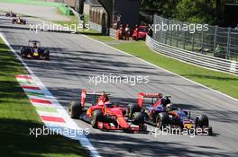 Kimi Raikkonen (FIN) Ferrari SF15-T and Carlos Sainz Jr (ESP) Scuderia Toro Rosso STR10 battle for position. 06.09.2015. Formula 1 World Championship, Rd 12, Italian Grand Prix, Monza, Italy, Race Day.