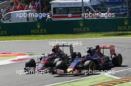 Max Verstappen (NLD) Scuderia Toro Rosso STR10 and Jenson Button (GBR) McLaren MP4-30 battle for position. 06.09.2015. Formula 1 World Championship, Rd 12, Italian Grand Prix, Monza, Italy, Race Day.