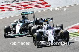 Valtteri Bottas (FIN) Williams FW37 and Nico Rosberg (GER) Mercedes AMG F1 W06 battle for position. 06.09.2015. Formula 1 World Championship, Rd 12, Italian Grand Prix, Monza, Italy, Race Day.