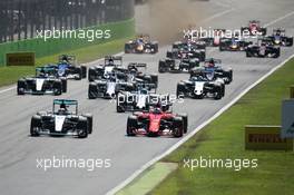 (L to R): Lewis Hamilton (GBR) Mercedes AMG F1 W06 and Sebastian Vettel (GER) Ferrari SF15-T at the start of the race. 06.09.2015. Formula 1 World Championship, Rd 12, Italian Grand Prix, Monza, Italy, Race Day.