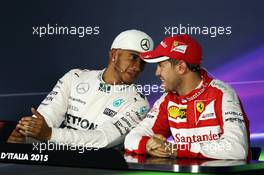 (L to R): Lewis Hamilton (GBR) Mercedes AMG F1 and Sebastian Vettel (GER) Ferrari in the post qualifying FIA Press Conference. 05.09.2015. Formula 1 World Championship, Rd 12, Italian Grand Prix, Monza, Italy, Qualifying Day.