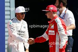 (L to R): Lewis Hamilton (GBR) Mercedes AMG F1 celebrates his pole position in parc ferme with second placed Kimi Raikkonen (FIN) Ferrari. 05.09.2015. Formula 1 World Championship, Rd 12, Italian Grand Prix, Monza, Italy, Qualifying Day.