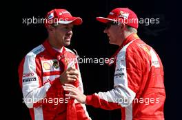 (L to R): third placed Sebastian Vettel (GER) Ferrari in parc ferme with second placed team mate Kimi Raikkonen (FIN) Ferrari. 05.09.2015. Formula 1 World Championship, Rd 12, Italian Grand Prix, Monza, Italy, Qualifying Day.