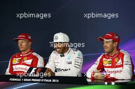 The post qualifying FIA Press Conference (L to R): Kimi Raikkonen (FIN) Ferrari; Lewis Hamilton (GBR) Mercedes AMG F1; Sebastian Vettel (GER) Ferrari. 05.09.2015. Formula 1 World Championship, Rd 12, Italian Grand Prix, Monza, Italy, Qualifying Day.