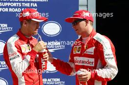 (L to R): third placed Sebastian Vettel (GER) Ferrari in parc ferme with second placed team mate Kimi Raikkonen (FIN) Ferrari. 05.09.2015. Formula 1 World Championship, Rd 12, Italian Grand Prix, Monza, Italy, Qualifying Day.