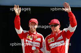(L to R): Third placed Sebastian Vettel (GER) Ferrari and second placed team mate Kimi Raikkonen (FIN) Ferrari celebrate in parc ferme. 05.09.2015. Formula 1 World Championship, Rd 12, Italian Grand Prix, Monza, Italy, Qualifying Day.