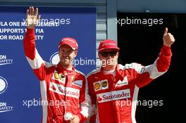 (L to R): Third placed Sebastian Vettel (GER) Ferrari and second placed team mate Kimi Raikkonen (FIN) Ferrari celebrate in parc ferme. 05.09.2015. Formula 1 World Championship, Rd 12, Italian Grand Prix, Monza, Italy, Qualifying Day.