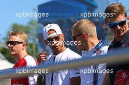 (L to R): Kimi Raikkonen (FIN) Ferrari; Lewis Hamilton (GBR) Mercedes AMG F1; Valtteri Bottas (FIN) Williams; Max Verstappen (NLD) Scuderia Toro Rosso, on the drivers parade observe a minute's silence for Justin Wilson. 06.09.2015. Formula 1 World Championship, Rd 12, Italian Grand Prix, Monza, Italy, Race Day.