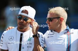(L to R): Lewis Hamilton (GBR) Mercedes AMG F1 and Valtteri Bottas (FIN) Williams on the drivers parade observe a minute's silence for Justin Wilson. 06.09.2015. Formula 1 World Championship, Rd 12, Italian Grand Prix, Monza, Italy, Race Day.
