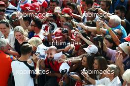 Jenson Button (GBR) McLaren signs autographs for the fans. 03.09.2015. Formula 1 World Championship, Rd 12, Italian Grand Prix, Monza, Italy, Preparation Day.