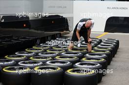 McLaren mechanic with Pirelli tyres. 03.09.2015. Formula 1 World Championship, Rd 12, Italian Grand Prix, Monza, Italy, Preparation Day.