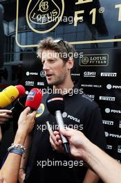 Romain Grosjean (FRA) Lotus F1 Team with the media. 03.09.2015. Formula 1 World Championship, Rd 12, Italian Grand Prix, Monza, Italy, Preparation Day.