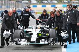 Lewis Hamilton (GBR) Mercedes AMG F1 W06 is pushed back down the pit lane. 02.02.2015. Formula One Testing, Day Two, Jerez, Spain.