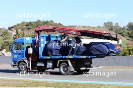 The Scuderia Toro Rosso STR10 of Carlos Sainz Jr (ESP) Scuderia Toro Rosso is recovered back to the pits on the back of a truck. 01.02.2015. Formula One Testing, Day One, Jerez, Spain.