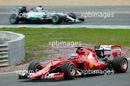 Kimi Raikkonen (FIN) Ferrari SF15-T leads Nico Rosberg (GER) Mercedes AMG F1 W06. 03.02.2015. Formula One Testing, Day Three, Jerez, Spain.