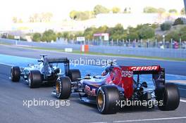 Lewis Hamilton (GBR) Mercedes AMG F1 W06 and Max Verstappen (NLD) Scuderia Toro Rosso STR10 at the pit lane exit. 04.02.2015. Formula One Testing, Day Four, Jerez, Spain.