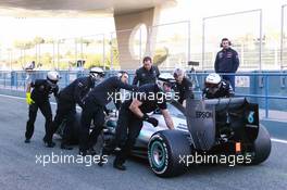 Lewis Hamilton (GBR) Mercedes AMG F1 W06 is pushed back down the pit lane by mechanics. 04.02.2015. Formula One Testing, Day Four, Jerez, Spain.