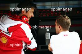 (L to R): Massimo Rivola (ITA) Ferrari Sporting Director with Sebastian Vettel (GER) Ferrari. 25.09.2015. Formula 1 World Championship, Rd 14, Japanese Grand Prix, Suzuka, Japan, Practice Day.
