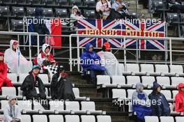 Fans in the grandstand and a banner for Jenson Button (GBR) McLaren. 25.09.2015. Formula 1 World Championship, Rd 14, Japanese Grand Prix, Suzuka, Japan, Practice Day.