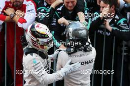 (L to R): Race winner Lewis Hamilton (GBR) Mercedes AMG F1 celebrates in parc ferme with second placed team mate Nico Rosberg (GER) Mercedes AMG F1. 27.09.2015. Formula 1 World Championship, Rd 14, Japanese Grand Prix, Suzuka, Japan, Race Day.