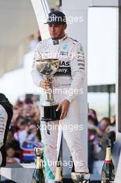 Race winner Lewis Hamilton (GBR) Mercedes AMG F1 celebrates on the podium. 27.09.2015. Formula 1 World Championship, Rd 14, Japanese Grand Prix, Suzuka, Japan, Race Day.