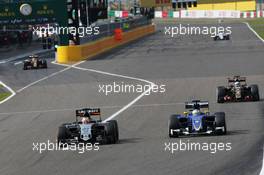 Nico Hulkenberg (GER) Sahara Force India F1 VJM08 and Marcus Ericsson (SWE) Sauber C34 battle for position. 27.09.2015. Formula 1 World Championship, Rd 14, Japanese Grand Prix, Suzuka, Japan, Race Day.