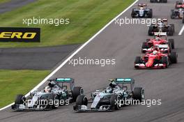 (L to R): Lewis Hamilton (GBR) Mercedes AMG F1 W06 and Nico Rosberg (GER) Mercedes AMG F1 W06 lead at the start of the race. 27.09.2015. Formula 1 World Championship, Rd 14, Japanese Grand Prix, Suzuka, Japan, Race Day.