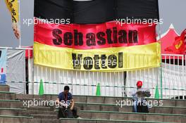 Fans in the grandstand and a banner for Sebastian Vettel (GER) Ferrari. 26.09.2015. Formula 1 World Championship, Rd 14, Japanese Grand Prix, Suzuka, Japan, Qualifying Day.