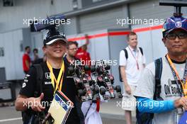 McLaren fan in the paddock. 26.09.2015. Formula 1 World Championship, Rd 14, Japanese Grand Prix, Suzuka, Japan, Qualifying Day.