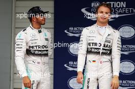 (L to R): Lewis Hamilton (GBR) Mercedes AMG F1 with team mate Nico Rosberg (GER) Mercedes AMG F1 in parc ferme. 26.09.2015. Formula 1 World Championship, Rd 14, Japanese Grand Prix, Suzuka, Japan, Qualifying Day.