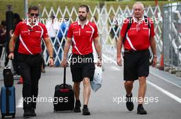 (L to R): Graeme Lowdon (GBR) Manor Marussia F1 Team Chief Executive Officer with Marc Hynes (GBR) Manor Marussia F1 Team Driver Coach and John Booth (GBR) Manor Marussia F1 Team Team Principal. 27.09.2015. Formula 1 World Championship, Rd 14, Japanese Grand Prix, Suzuka, Japan, Race Day.