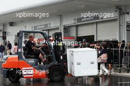 Lotus F1 Team mechanic with forklift truck in the paddock. 24.09.2015. Formula 1 World Championship, Rd 14, Japanese Grand Prix, Suzuka, Japan, Preparation Day.
