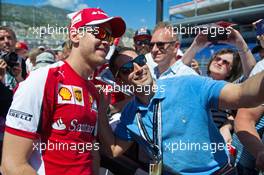 Sebastian Vettel (GER) Ferrari with fans. 22.05.2015. Formula 1 World Championship, Rd 6, Monaco Grand Prix, Monte Carlo, Monaco, Friday.