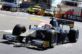 Martin Brundle (GBR) Sky Sports Commentator demonstrates the Pirelli 18" tyre with a GP2 car. 22.05.2015. Formula 1 World Championship, Rd 6, Monaco Grand Prix, Monte Carlo, Monaco, Friday.