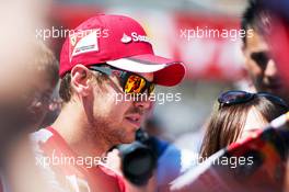 Sebastian Vettel (GER) Ferrari signs autographs for the fans. 22.05.2015. Formula 1 World Championship, Rd 6, Monaco Grand Prix, Monte Carlo, Monaco, Friday.