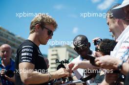 Nico Rosberg (GER) Mercedes AMG F1 signs autographs for the fans. 22.05.2015. Formula 1 World Championship, Rd 6, Monaco Grand Prix, Monte Carlo, Monaco, Friday.