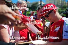 Kimi Raikkonen (FIN) Ferrari signs autographs for the fans. 22.05.2015. Formula 1 World Championship, Rd 6, Monaco Grand Prix, Monte Carlo, Monaco, Friday.