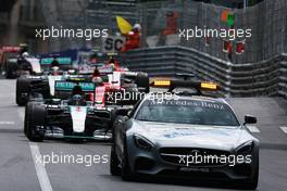 Nico Rosberg (GER) Mercedes AMG F1 W06 leads behind the FIA Safety Car. 24.05.2015. Formula 1 World Championship, Rd 6, Monaco Grand Prix, Monte Carlo, Monaco, Race Day.