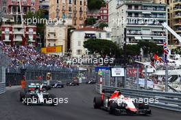 Roberto Merhi (ESP) Manor Marussia F1 Team passes Nico Rosberg (GER) Mercedes AMG F1 W06. 24.05.2015. Formula 1 World Championship, Rd 6, Monaco Grand Prix, Monte Carlo, Monaco, Race Day.